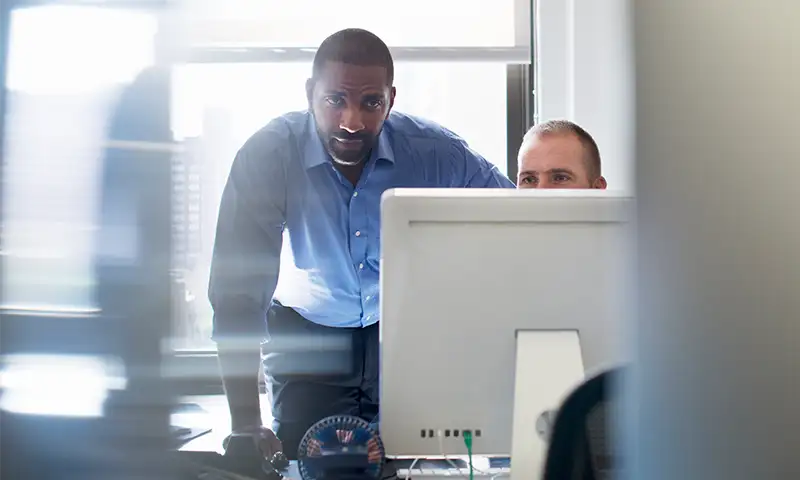 cybersecurity professionals reviewing systems