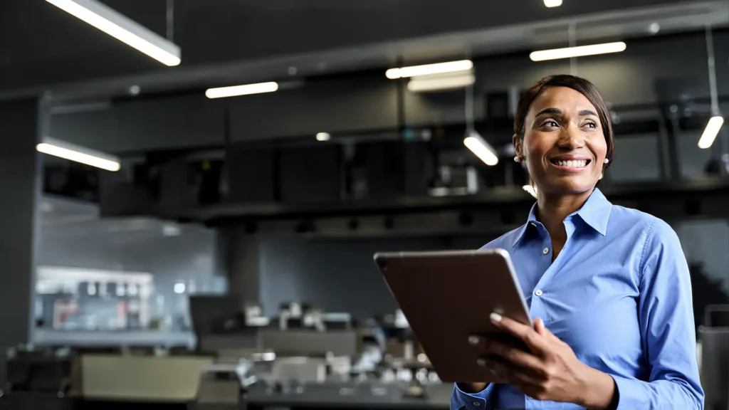 happy business woman interacting with her organization's cloud solution