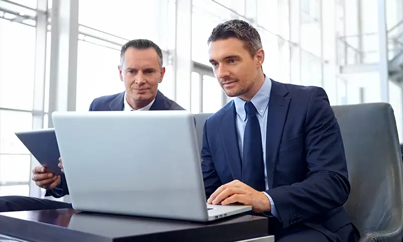 federal agents on a laptop