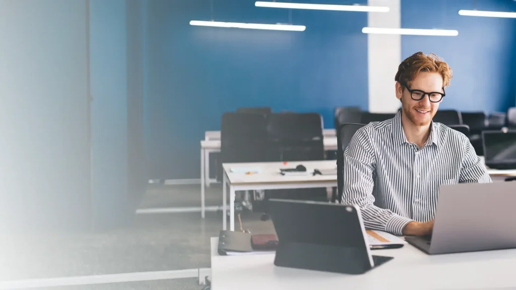 Man in an office using devices featuring Intel processors