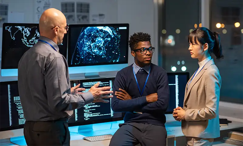 Security professionals talking through data protections and recovery initiatives